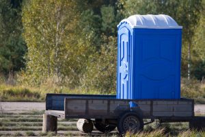 porta potty on top of a pulling cart