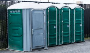 line of porta potties in a concrete