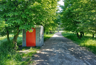 porta potty outdoors near a trail