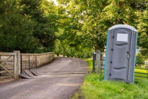 outdoor porta potty near the road