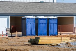 porta potties near a house contruction